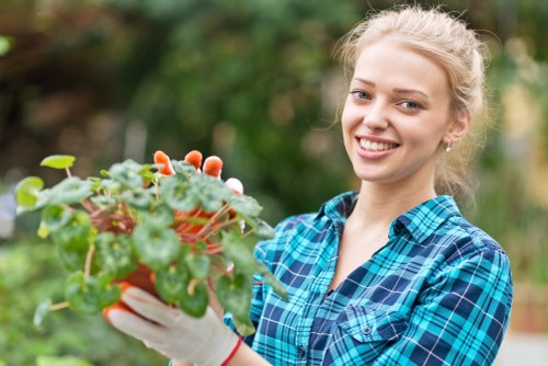 Garden maintenance team assessing green waste for recycling