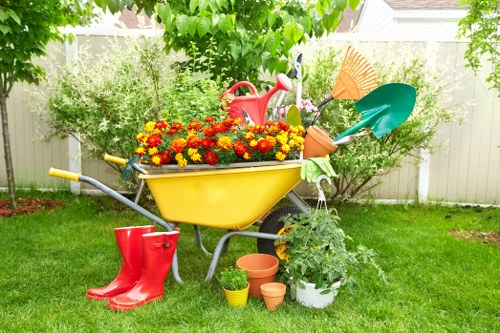 Segregated bins for green waste and recyclables at a garden site