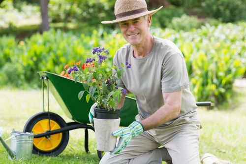 Workers performing seasonal garden maintenance in Hounslow